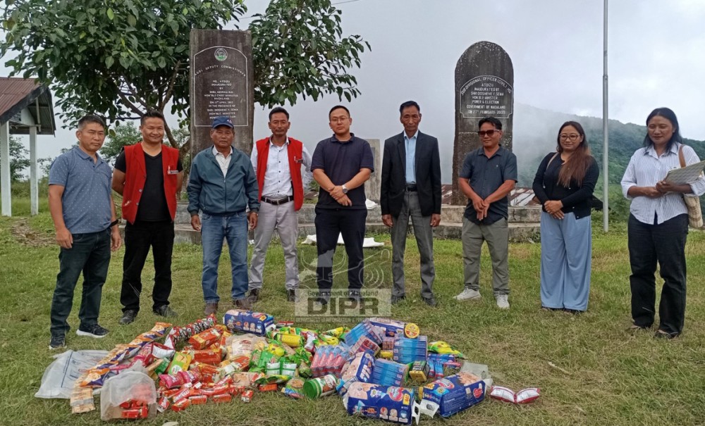 Inspection team with expired food items seized an inspection of shops and business establishments across Atoizu town on August 18. (DIPR Photo)